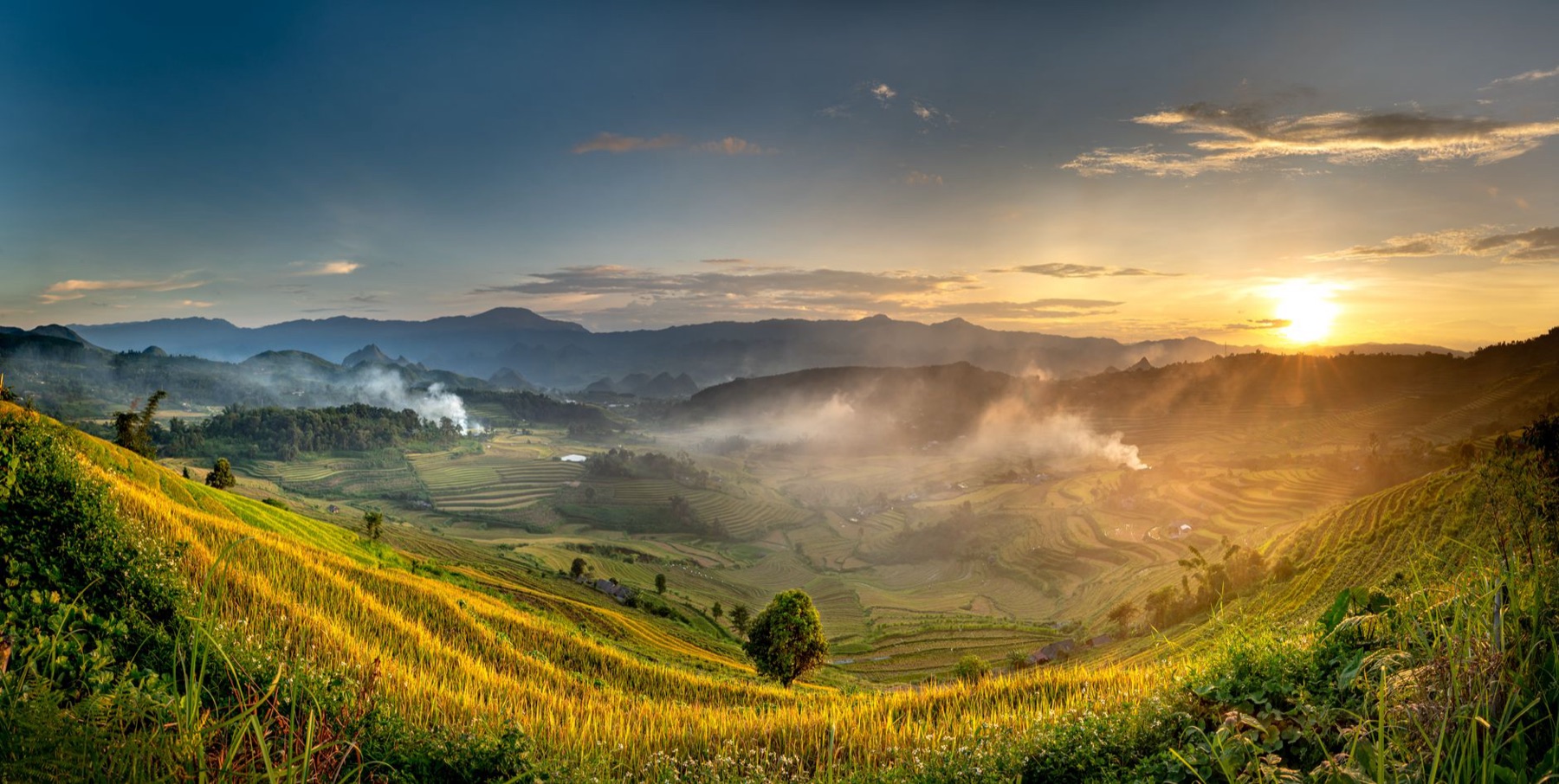 Dien Bien — Stunning sunrise over lush terraced rice fields in the mountains, capturing natu