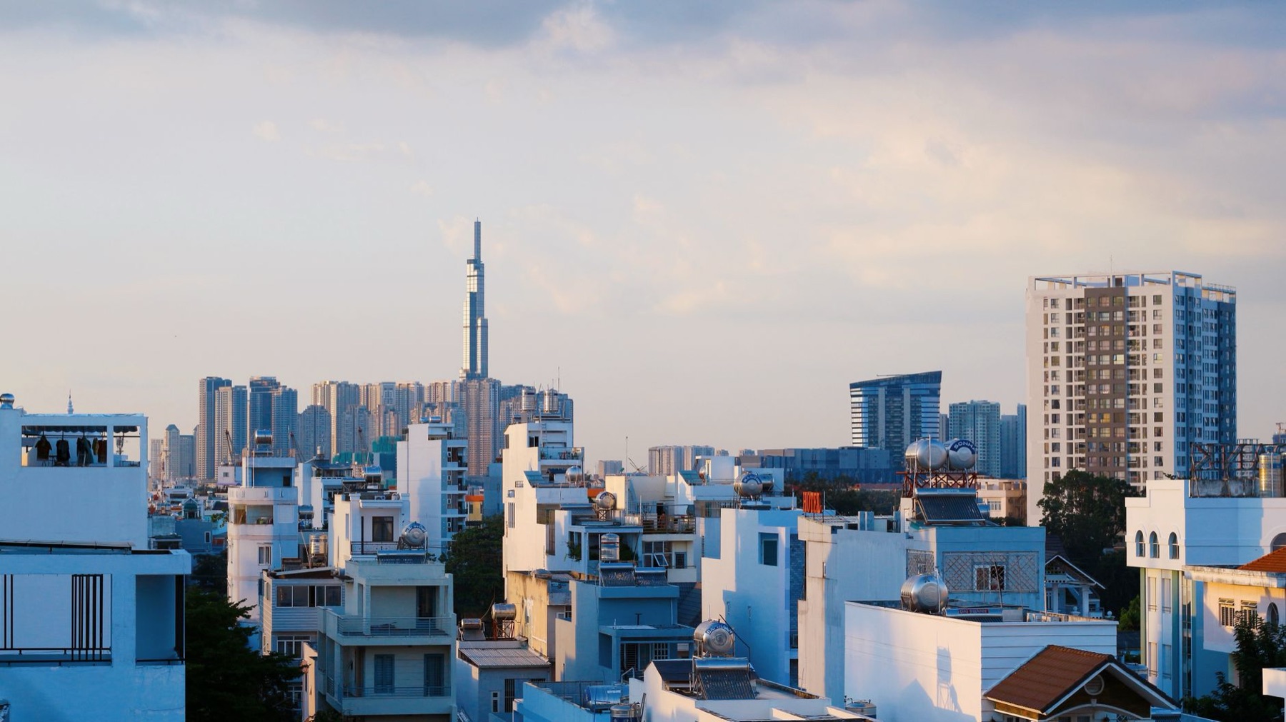 Ho Chi Minh City — A scenic aerial view of a city skyline with modern skyscrapers under a blue sky.