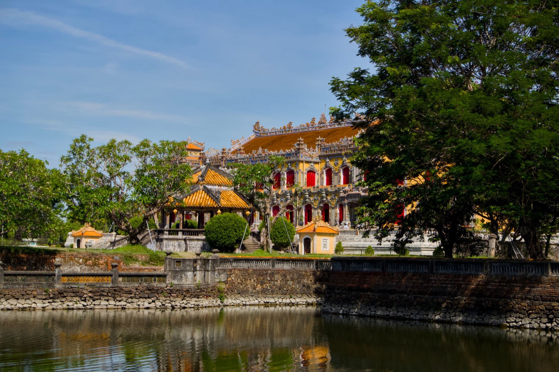 Hue — A beautiful Vietnamese temple with intricate architecture reflected in a serene